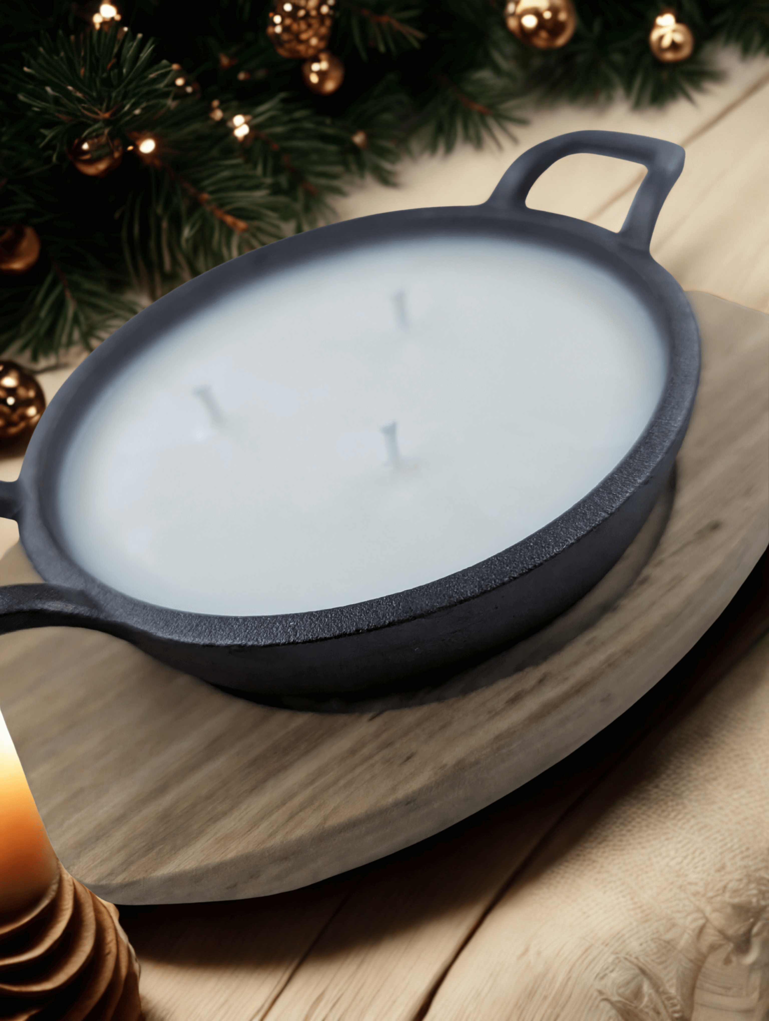 Tinsel & Treason candle in a cast iron skillet, featuring a holiday scent of bacon, cranberry, and dark musk.